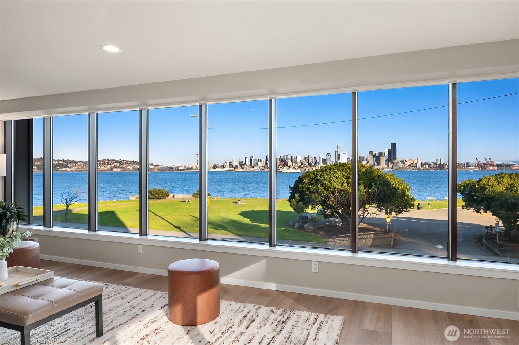 1111 Harbor Avenue Southwest, Unit 200 Seattle, WA 98116 - Photo 10 of 32 a view of a living room with a floor to ceiling window and balcony
