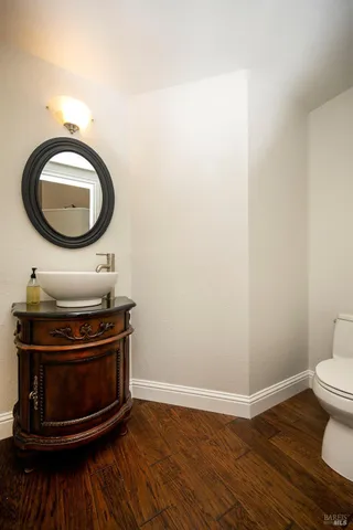a bathroom with a stove and a mirror