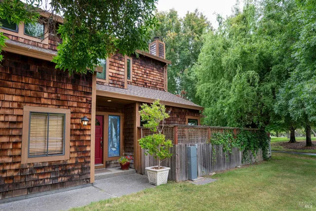 a view of a house with a yard and plants