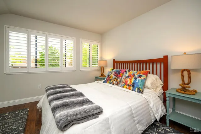 a bedroom with bed and a window