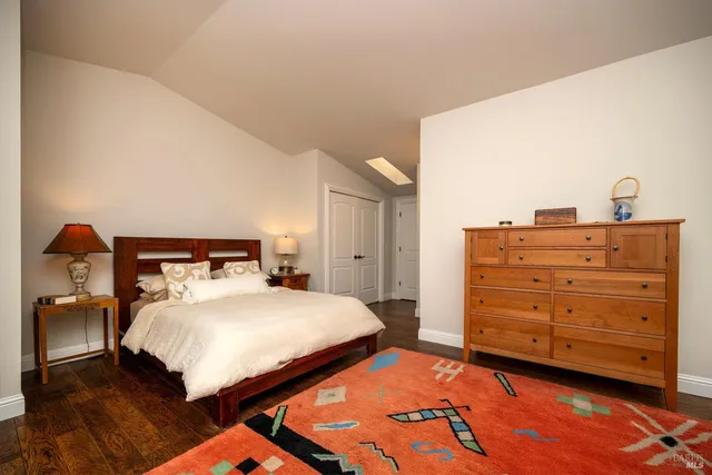 a bedroom with a bed and a dresser