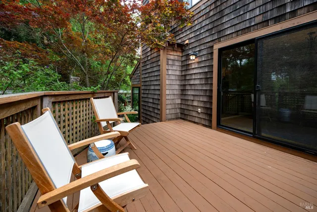 a view of deck with wooden floor and seating space