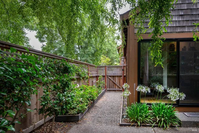 a view of a chair and tables in the balcony
