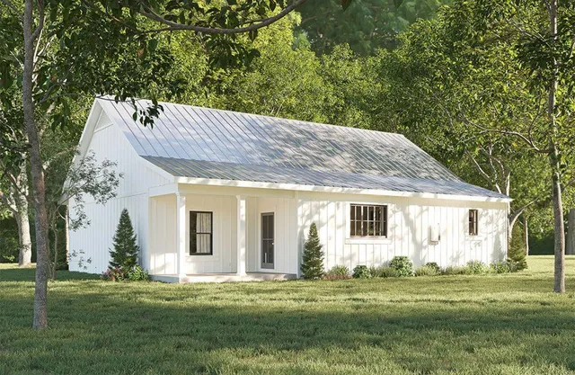 a backyard of a house with outdoor seating and plants