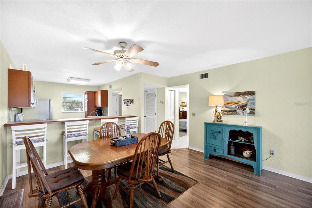 175 Kings Highway, Unit 516 Punta Gorda, FL 33983 - Photo 12 of 37 a view of a dining room with furniture and wooden floor