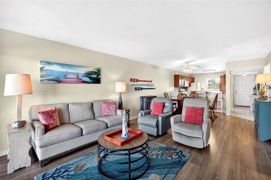175 Kings Highway, Unit 516 Punta Gorda, FL 33983 - Photo 15 of 37 a living room with furniture and a wooden floor