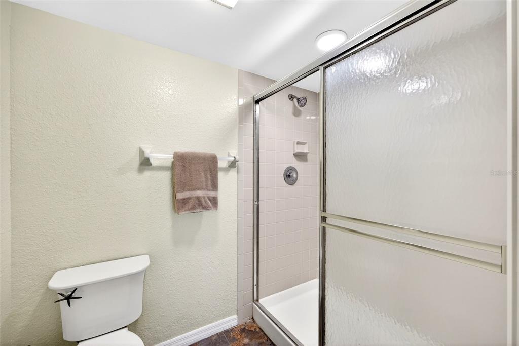 175 Kings Highway, Unit 516 Punta Gorda, FL 33983 - Photo 20 of 37 a bathroom with a shower and toilet
