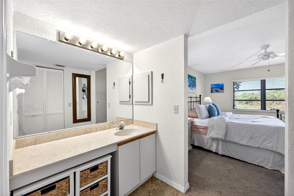 175 Kings Highway, Unit 516 Punta Gorda, FL 33983 - Photo 21 of 37 a bathroom with double vanity and a bathtub