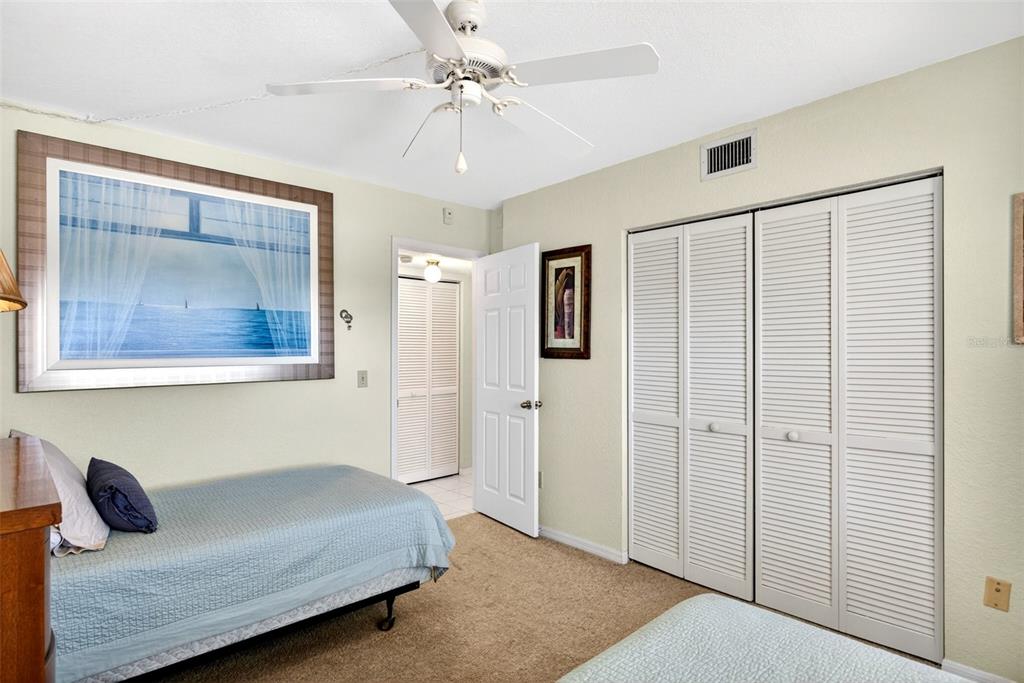 175 Kings Highway, Unit 516 Punta Gorda, FL 33983 - Photo 23 of 37 a bedroom with a bed and a painting on the wall