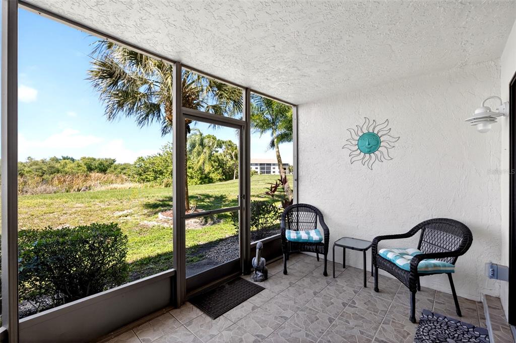 175 Kings Highway, Unit 516 Punta Gorda, FL 33983 - Photo 25 of 37 a view of a chairs and table in patio
