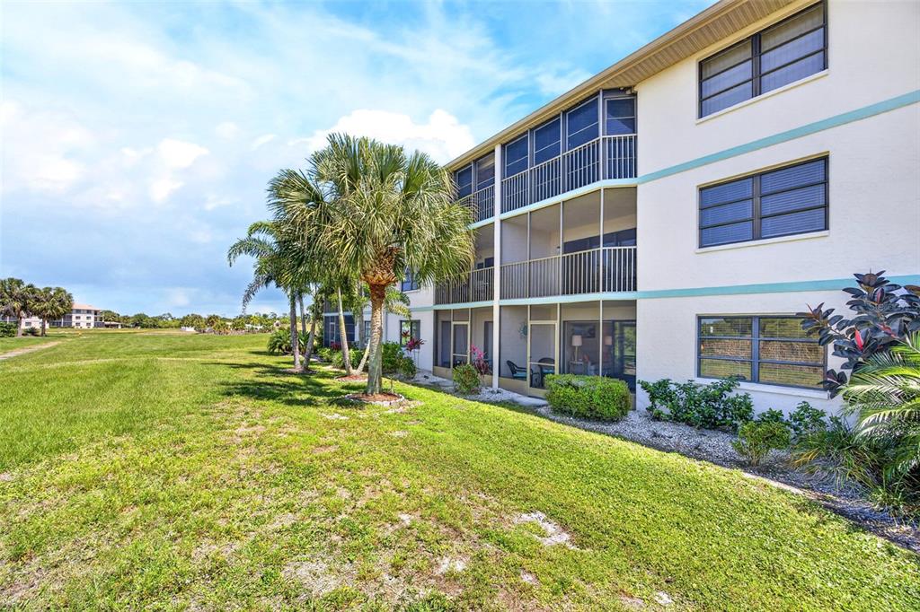175 Kings Highway, Unit 516 Punta Gorda, FL 33983 - Photo 29 of 37 a view of building with yard