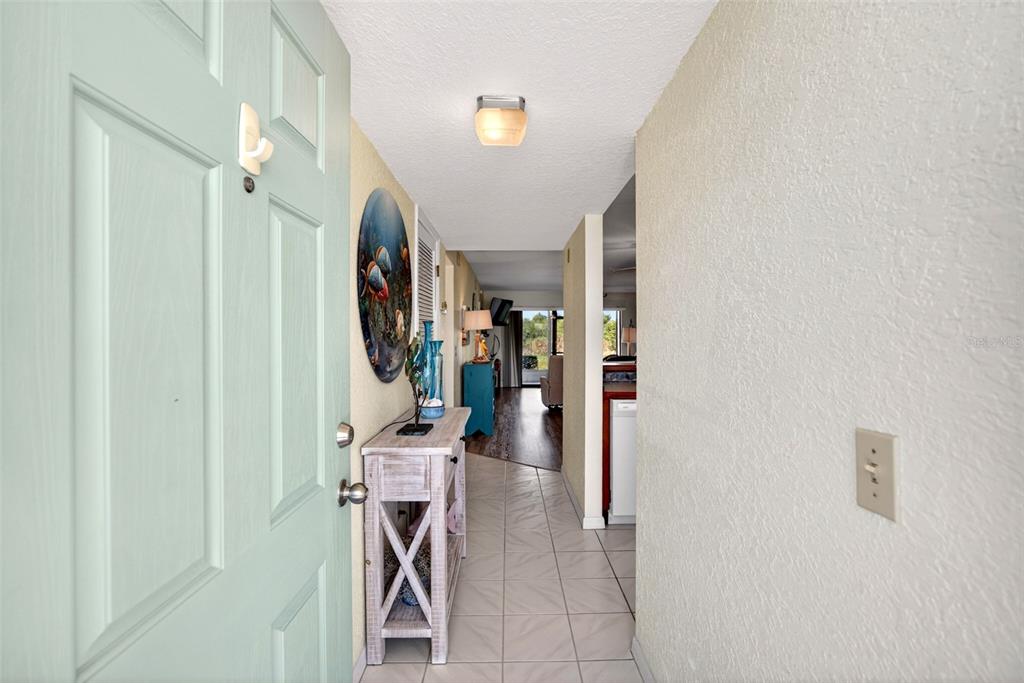 175 Kings Highway, Unit 516 Punta Gorda, FL 33983 - Photo 3 of 37 a view of a hallway with furniture and entryway