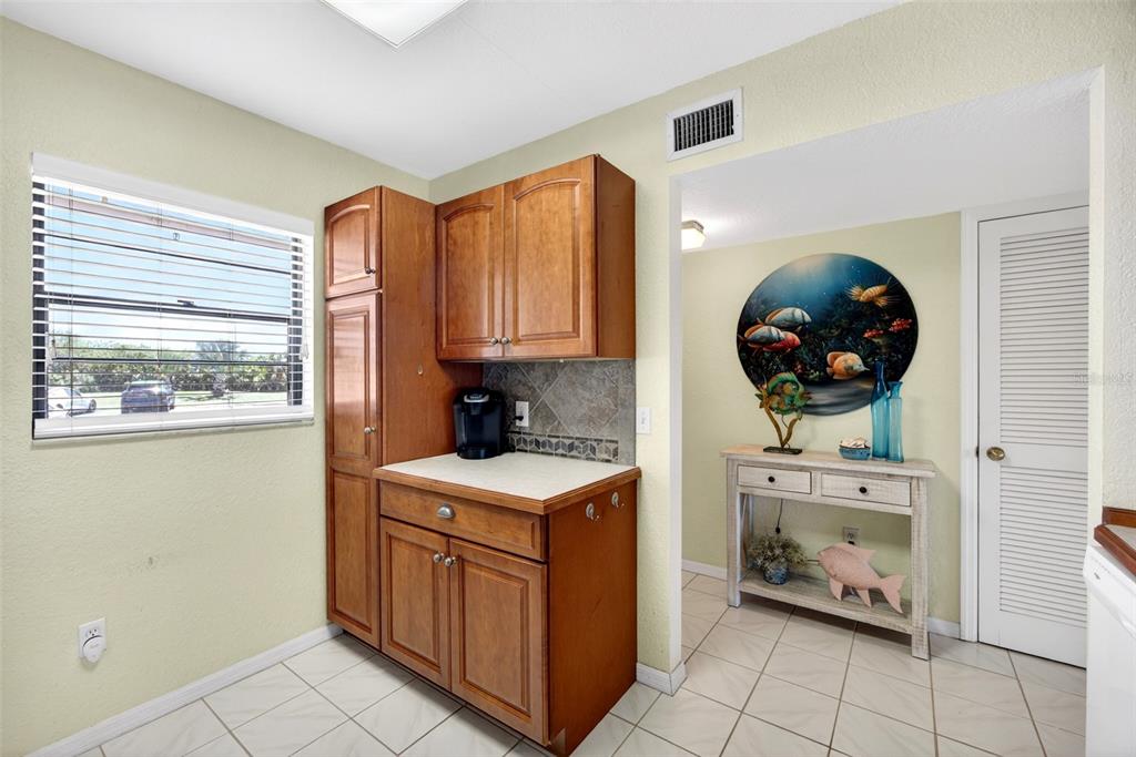 175 Kings Highway, Unit 516 Punta Gorda, FL 33983 - Photo 8 of 37 a kitchen with stainless steel appliances granite countertop a stove a sink and a microwave