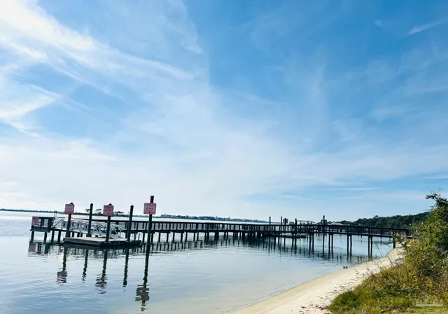 a view of a lake with outdoor seating