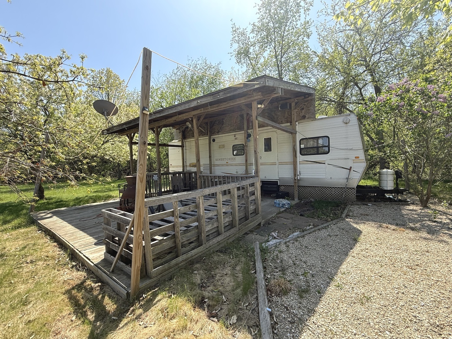 19-77 Woodhaven Lakes Sublette, IL 61367 - Photo 2 of 3 a front view of a house with garden