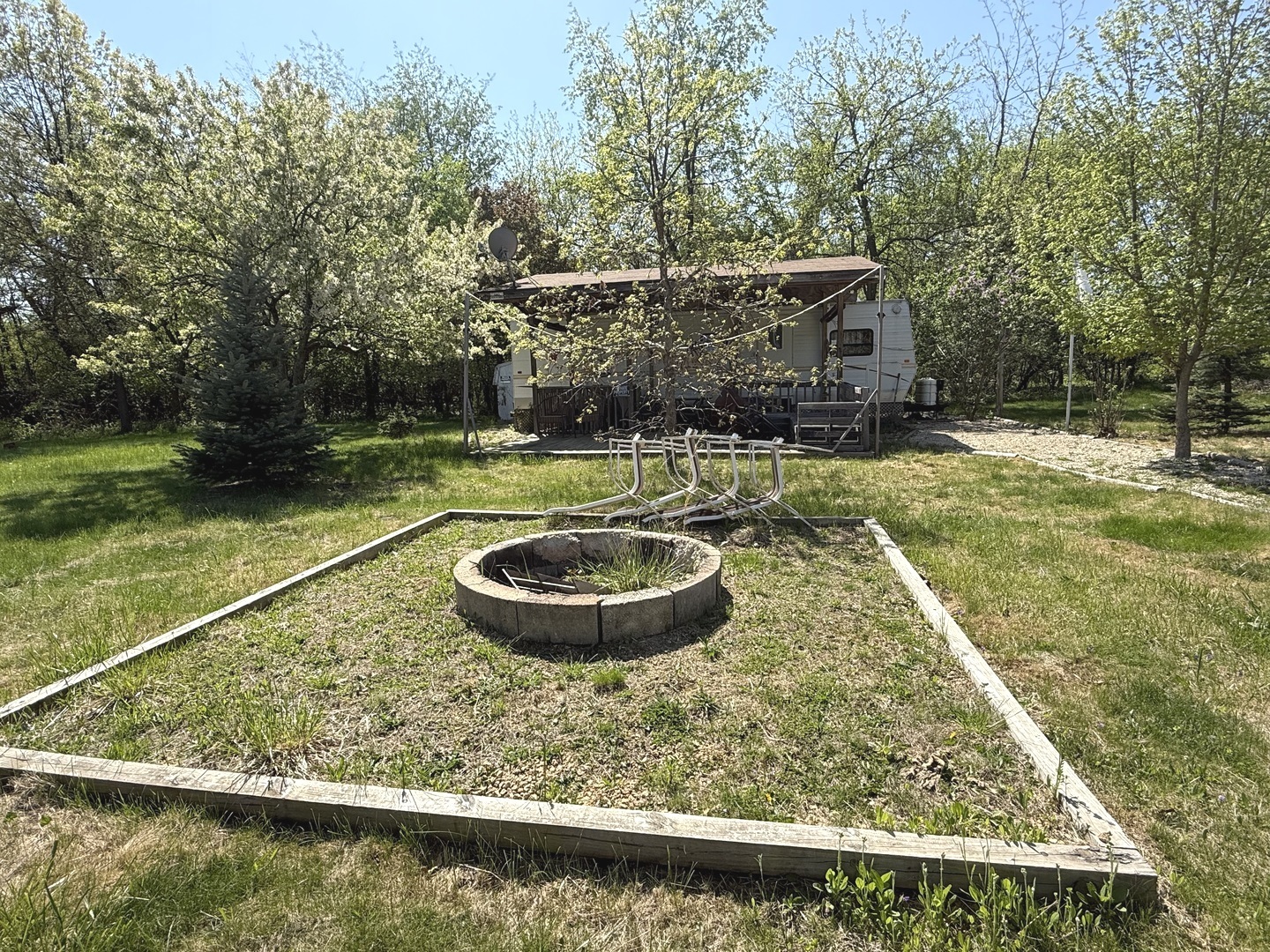 19-77 Woodhaven Lakes Sublette, IL 61367 - Photo 3 of 3 a view of a swimming pool with a patio and a yard