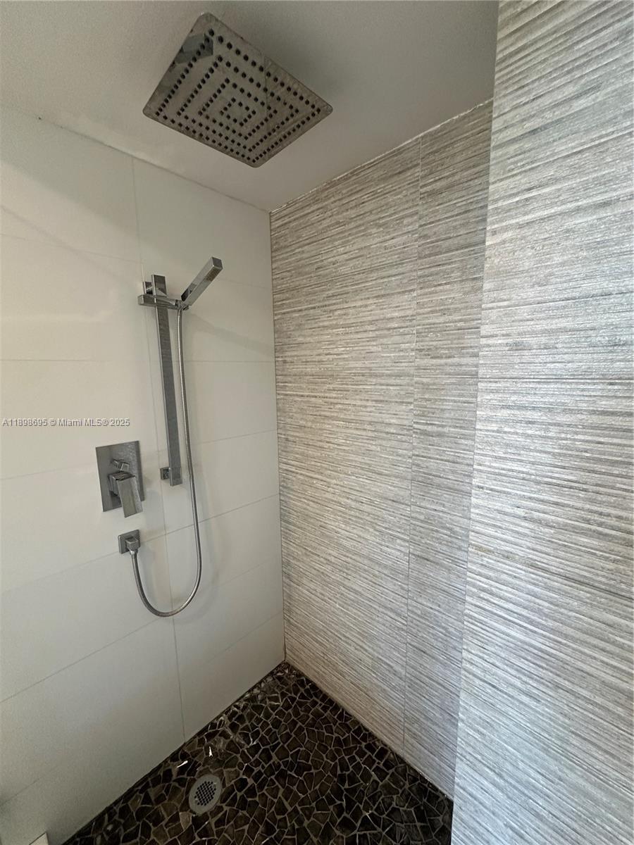 555 Northeast 15th Street, Unit 23B Miami, FL 33132 - Photo 16 of 32 a bathroom with a shower