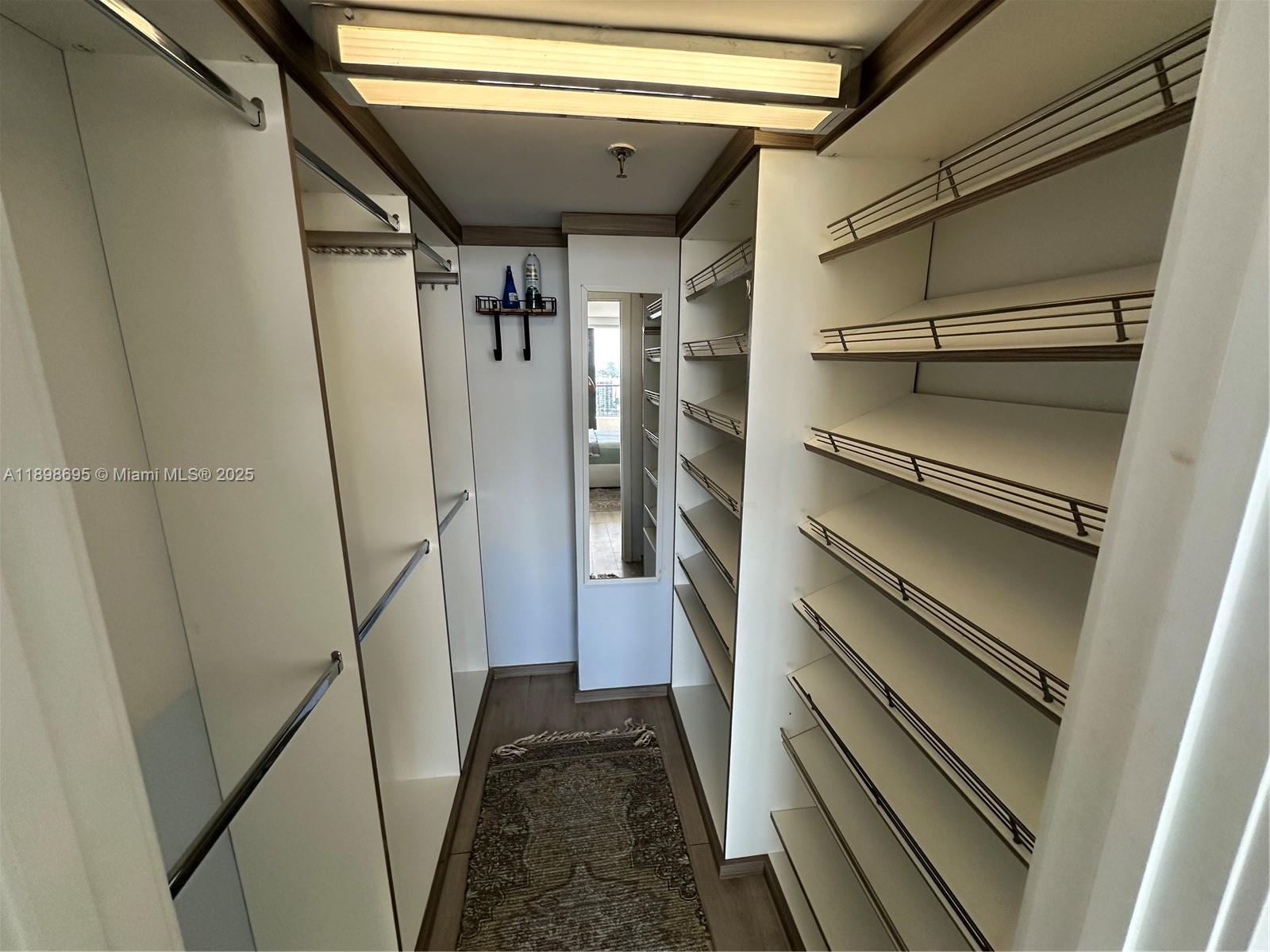 555 Northeast 15th Street, Unit 23B Miami, FL 33132 - Photo 18 of 32 a view of walk in closet