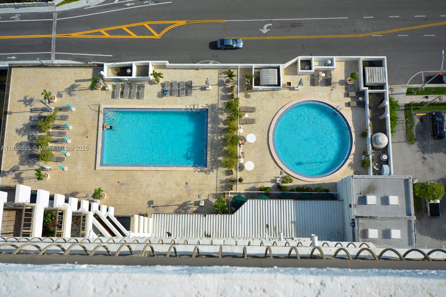 555 Northeast 15th Street, Unit 23B Miami, FL 33132 - Photo 28 of 32 a bathroom with a sink a mirror and vanity