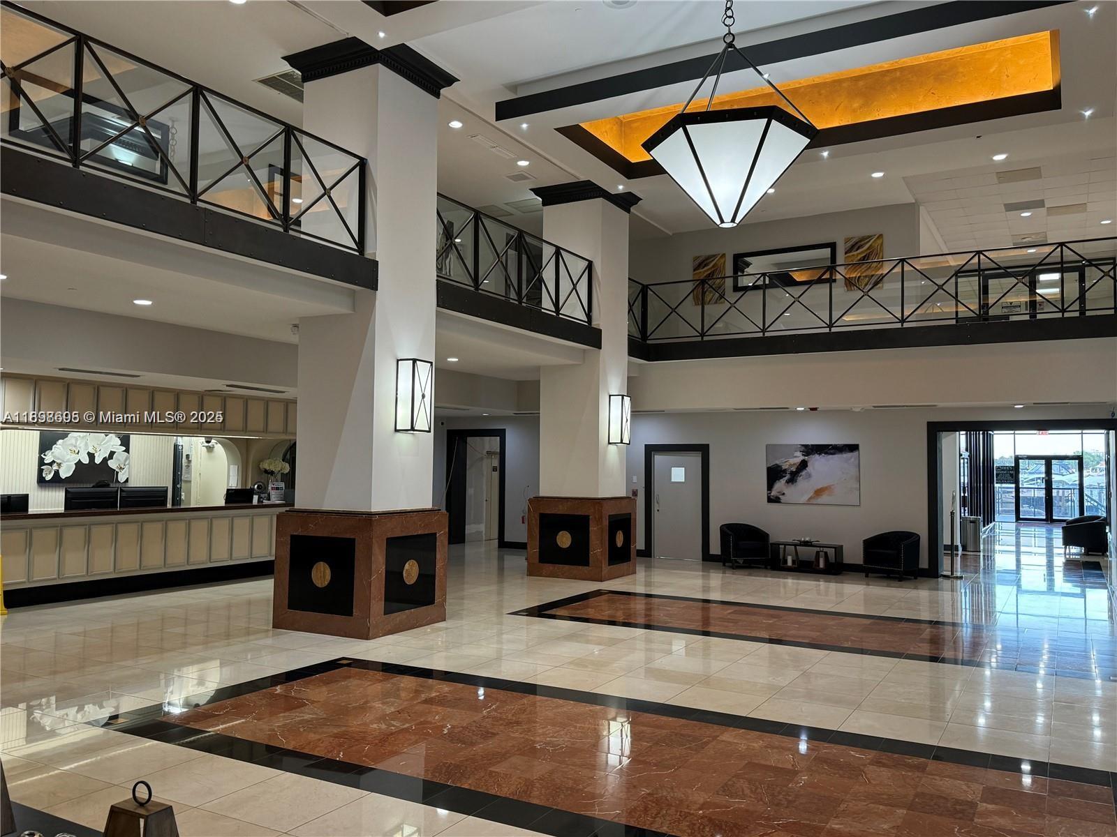 555 Northeast 15th Street, Unit 23B Miami, FL 33132 - Photo 31 of 32 a view of living room kitchen with stainless steel appliances granite countertop living room and living room view
