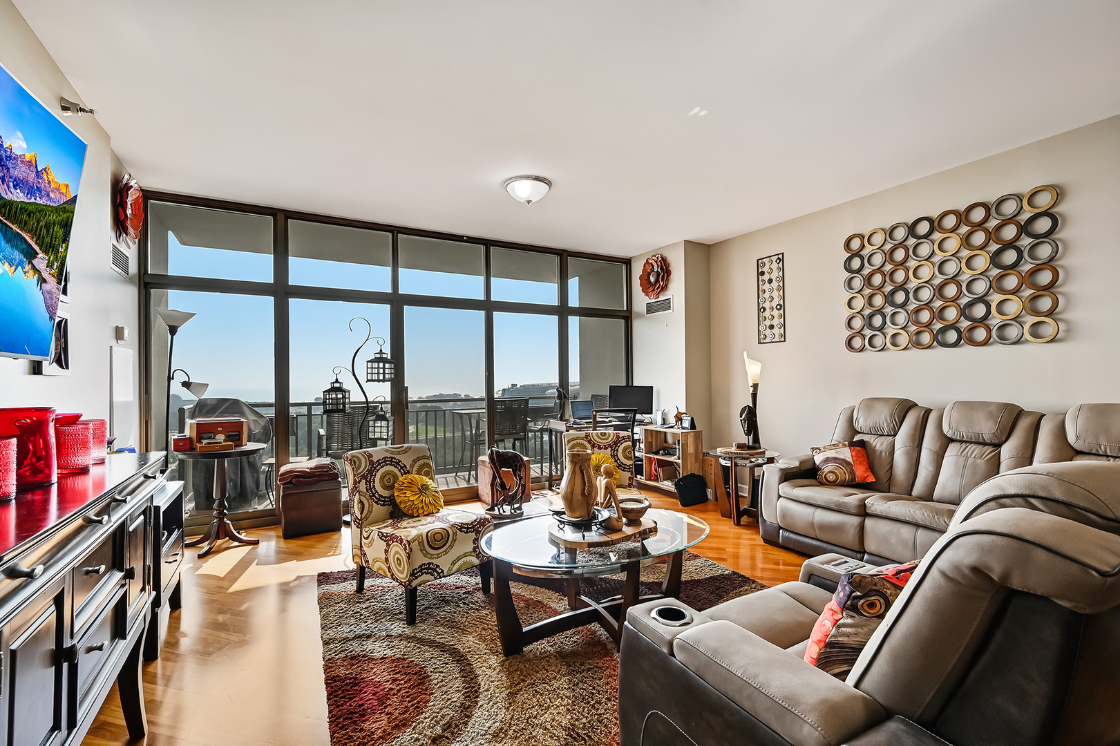 1335 South Prairie Avenue, Unit 1504 Chicago, IL 60605 - Photo 5 of 20 a living room with furniture and a floor to ceiling window