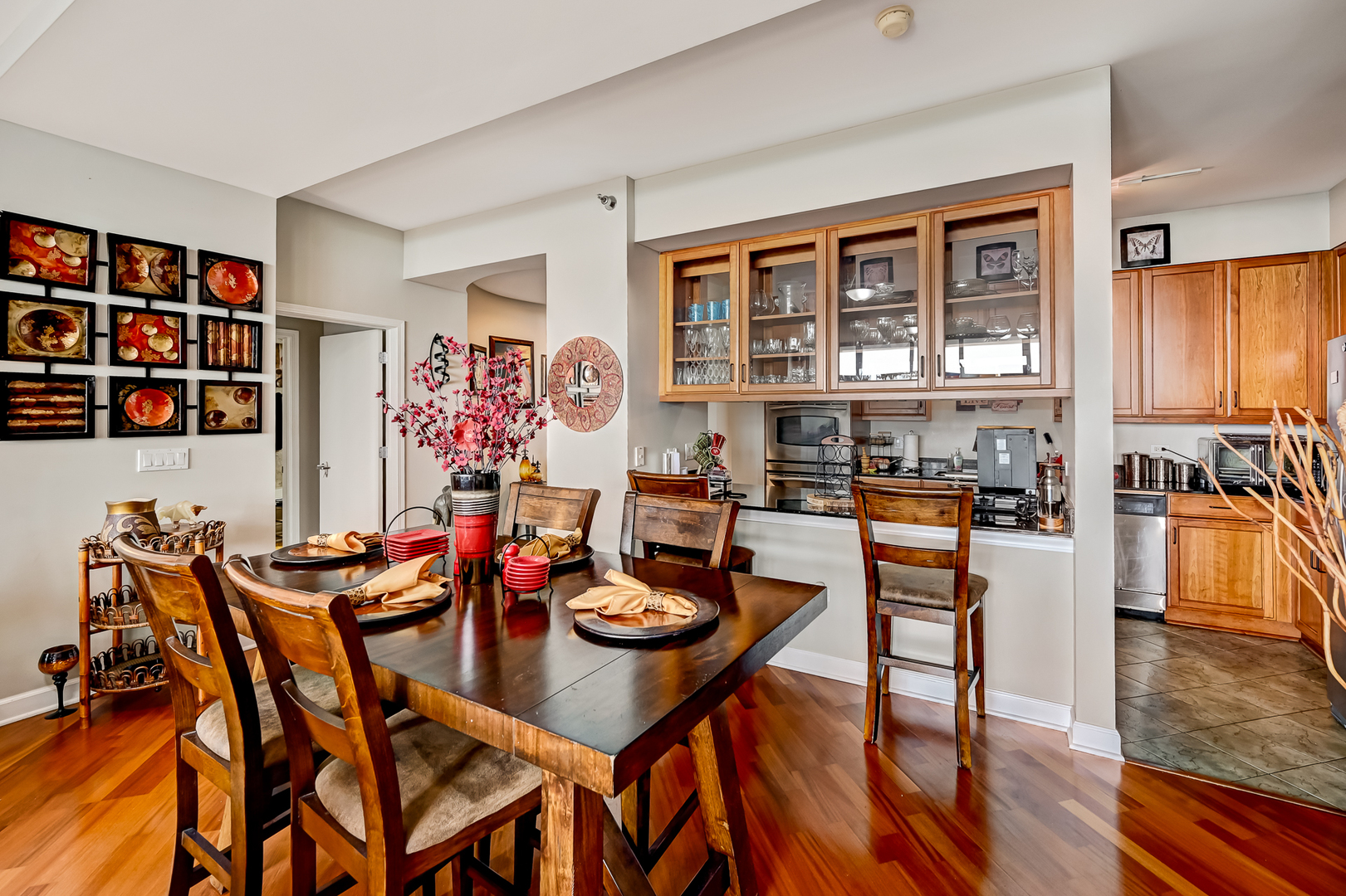 1335 South Prairie Avenue, Unit 1504 Chicago, IL 60605 - Photo 9 of 20 a view of a dining room with furniture and wooden floor