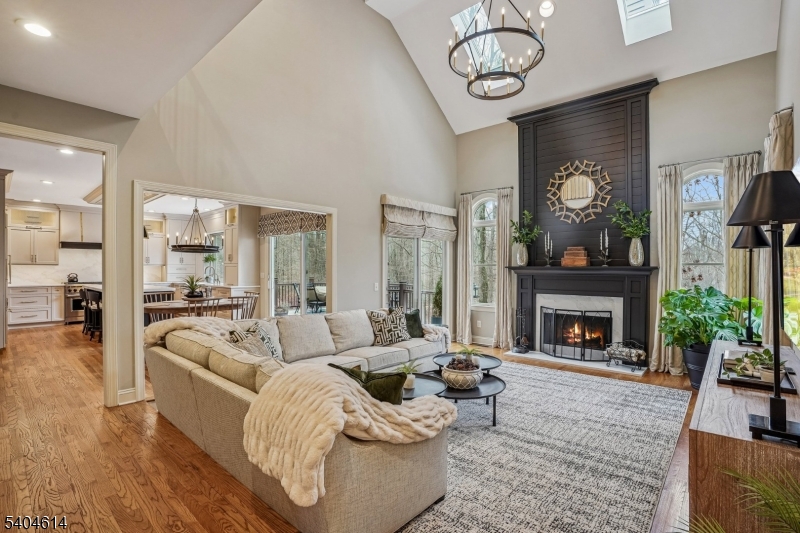 36 West Springtown Road Long Valley, NJ 07853 - Photo 18 of 50 a living room with furniture a fireplace and a floor to ceiling window