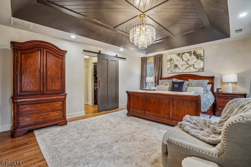36 West Springtown Road Long Valley, NJ 07853 - Photo 25 of 50 a bedroom with furniture and a chandelier