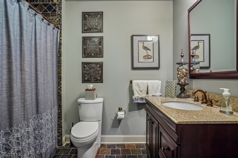 36 West Springtown Road Long Valley, NJ 07853 - Photo 42 of 50 a bathroom with a granite countertop toilet sink and mirror