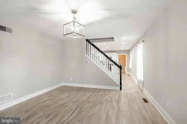 a view of entryway with wooden floor