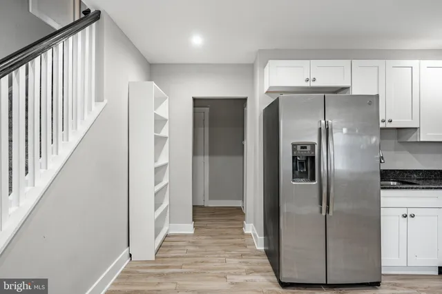 a kitchen with cabinets and stainless steel appliances