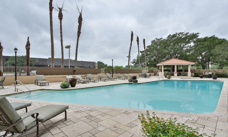 3525 Sage Road, Unit 318 Houston, TX 77056 - Photo 13 of 46 a view of a lake with chairs