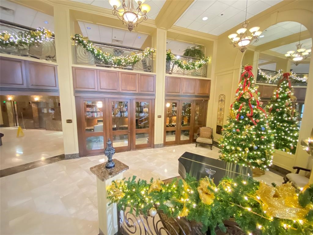 3525 Sage Road, Unit 318 Houston, TX 77056 - Photo 10 of 46 a lobby with furniture and floor to ceiling window