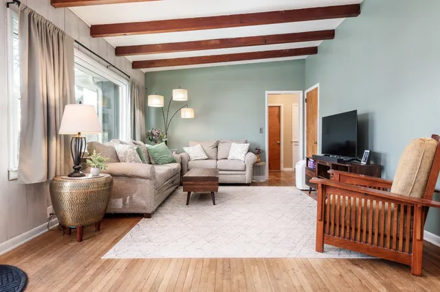 a living room with furniture and a window