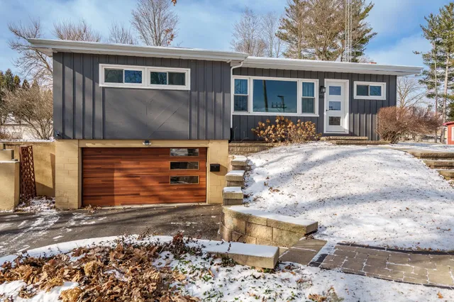 a front view of a house with garden
