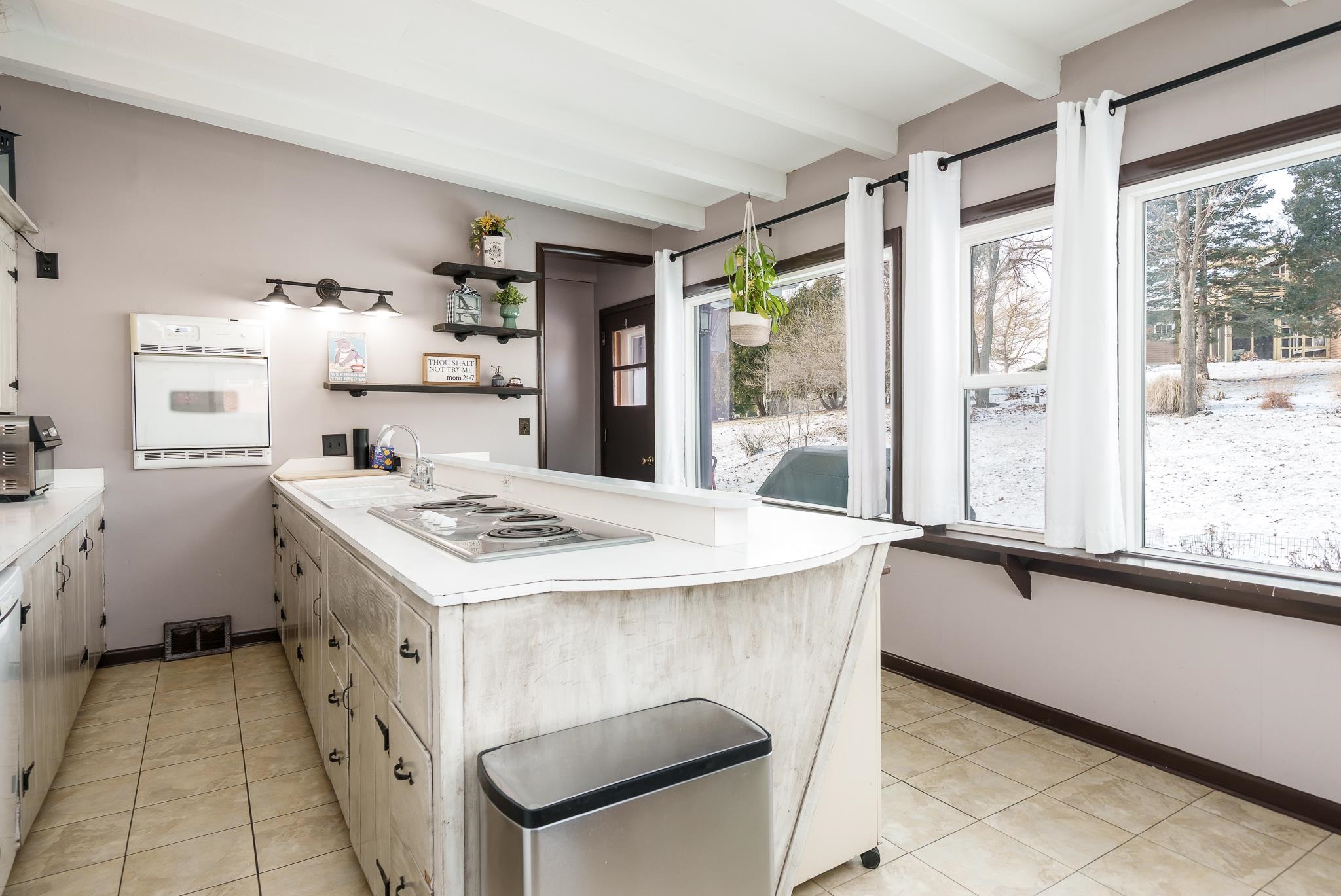 106 Mix Street Oregon, IL 61061 - Photo 21 of 49 a kitchen that has a sink and a stove in it