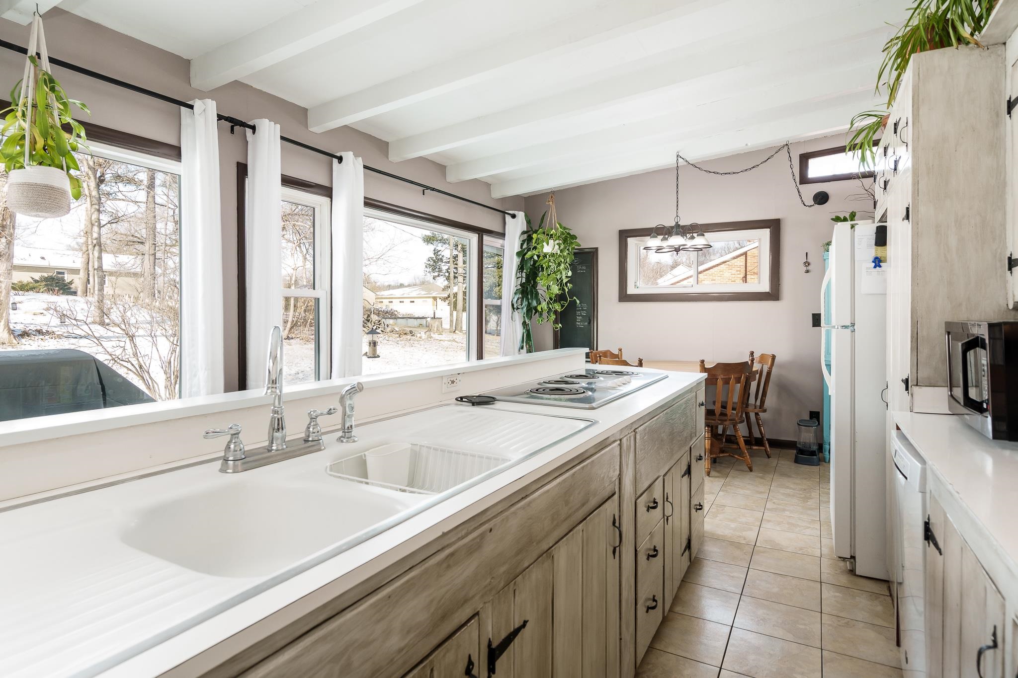106 Mix Street Oregon, IL 61061 - Photo 26 of 49 a kitchen with a sink stove and cabinets