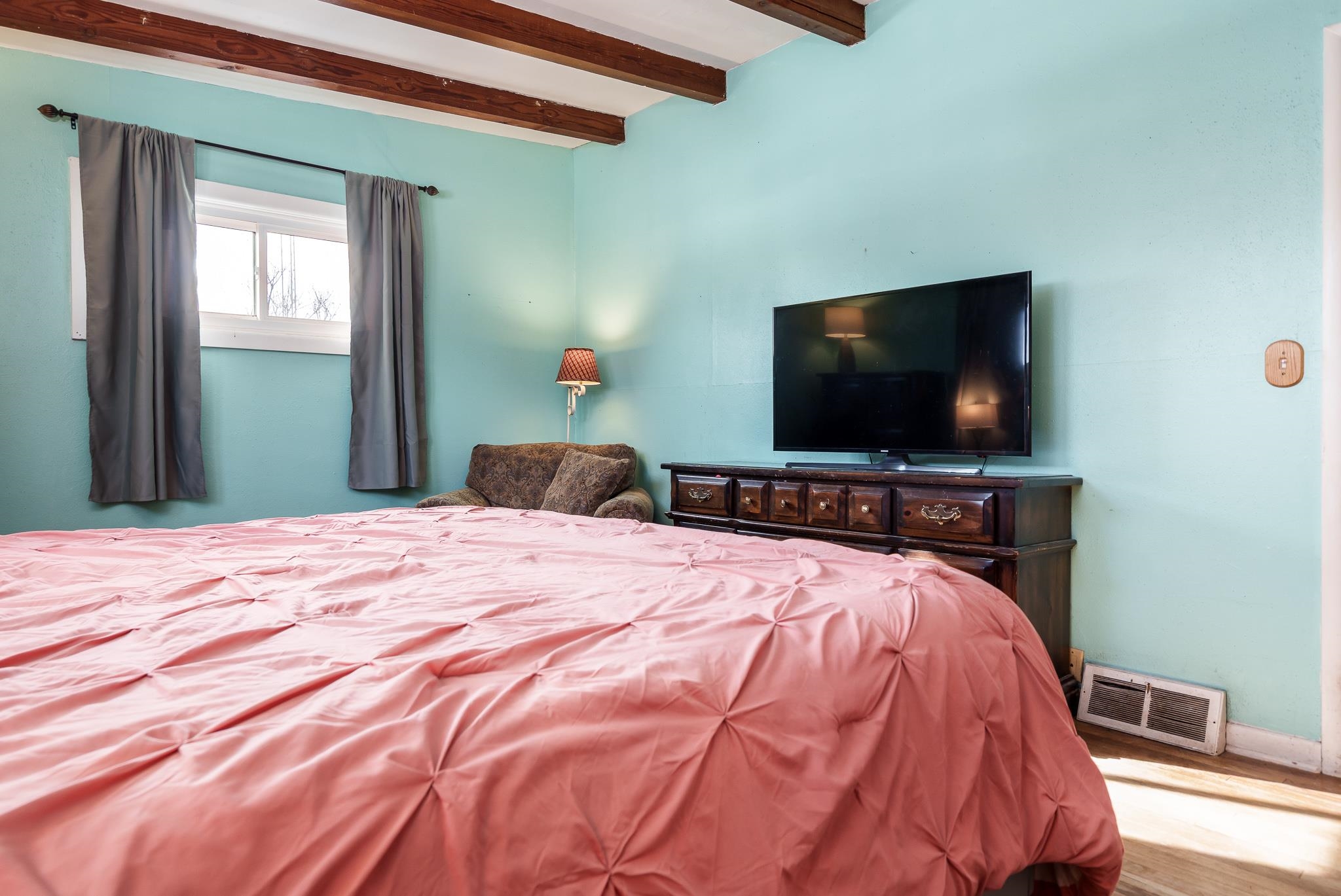 106 Mix Street Oregon, IL 61061 - Photo 29 of 49 a bedroom with a bed and a flat screen tv