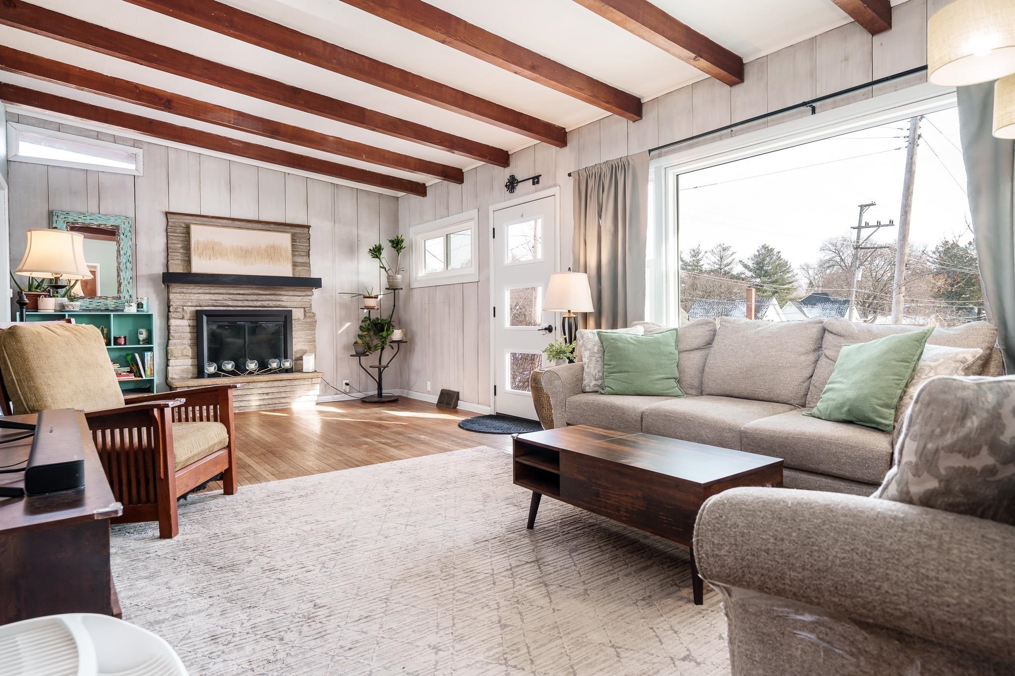 106 Mix Street Oregon, IL 61061 - Photo 31 of 49 a living room with furniture fireplace and a large window