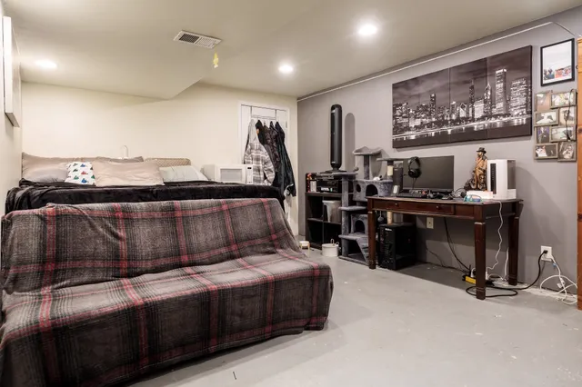 a room with furniture and flat screen tv