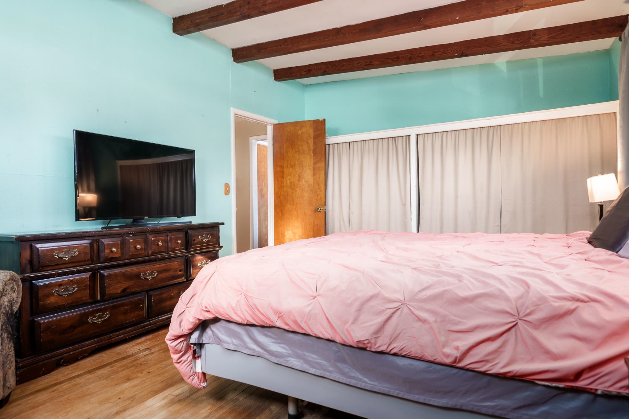 106 Mix Street Oregon, IL 61061 - Photo 38 of 49 a bedroom with a bed and a flat screen tv