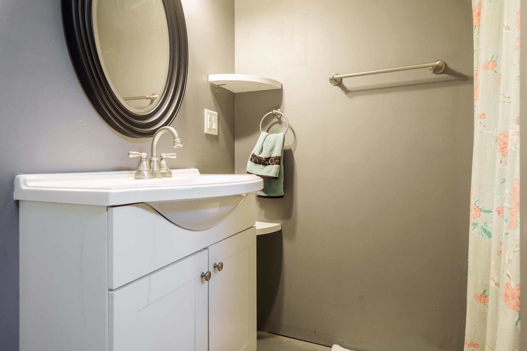 106 Mix Street Oregon, IL 61061 - Photo 39 of 49 a bathroom with a sink and a mirror