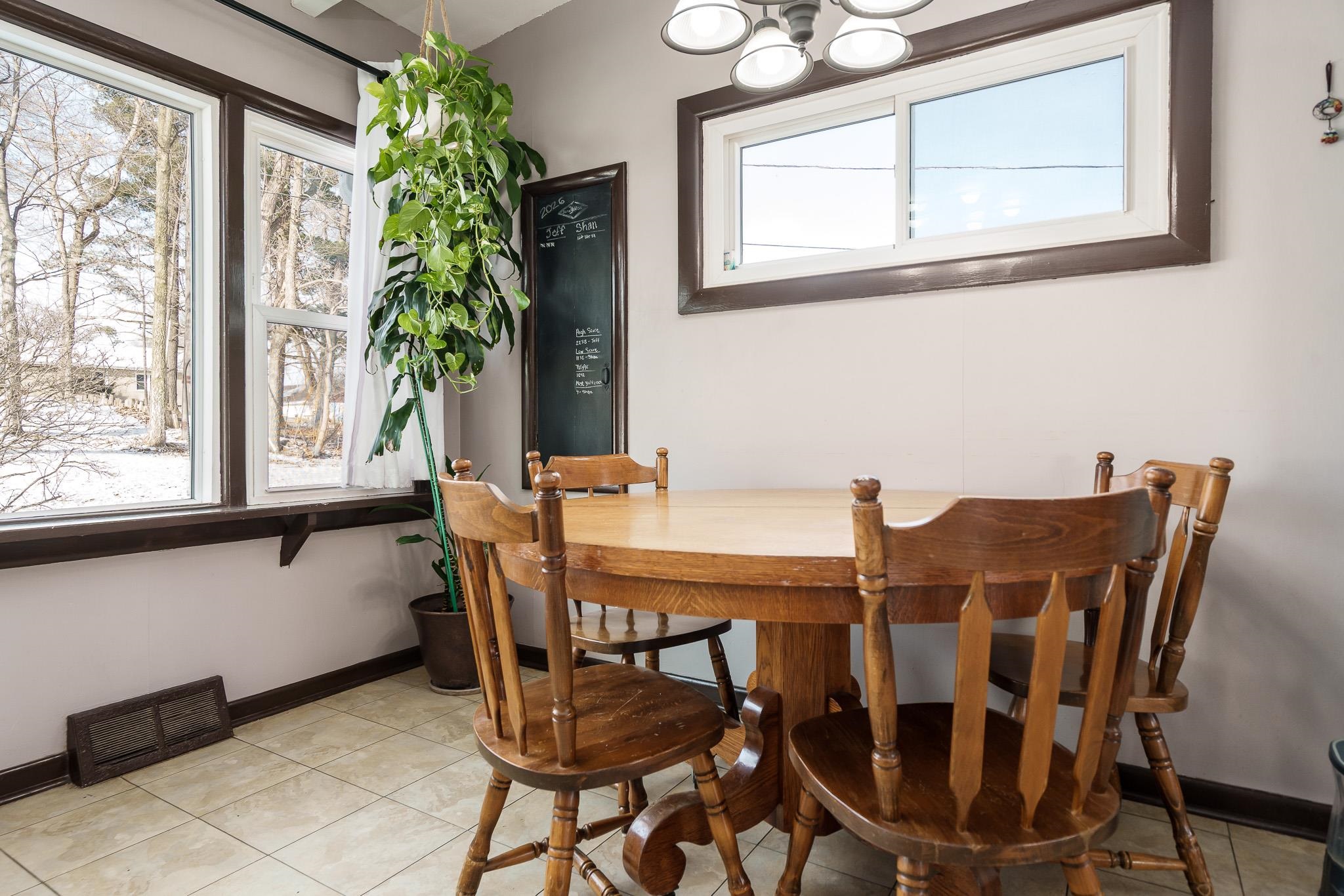 106 Mix Street Oregon, IL 61061 - Photo 6 of 49 a view of a dining room with furniture and a potted plant