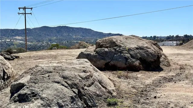 a view of a dry yard with mountain