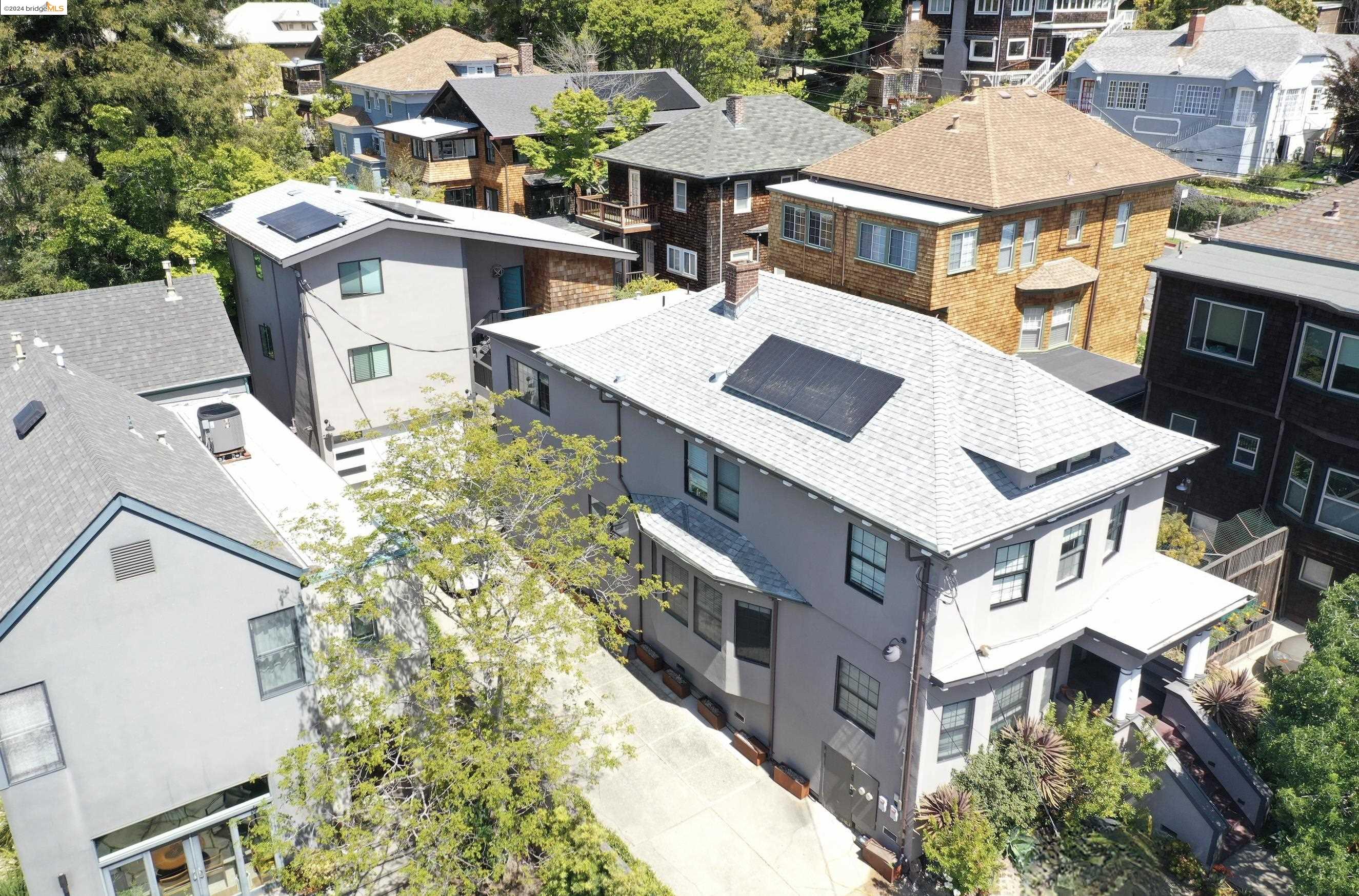 an aerial view of a residential apartment building with a yard