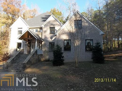 34 Orchard Spring Drive Southwest Rome, GA 30165 - Photo 1 of 1 a view of a white house next to a yard