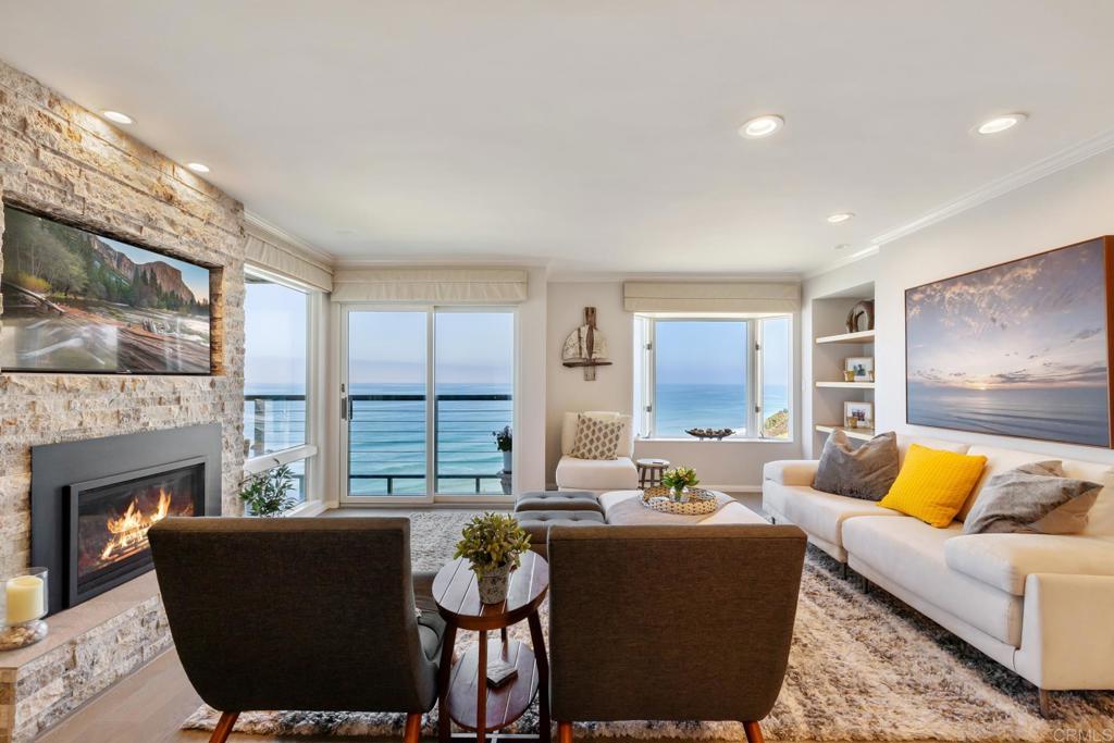 940 Sealane Drive, Unit 14 Encinitas, CA 92024 - Photo 2 of 45 a living room with furniture and a fireplace