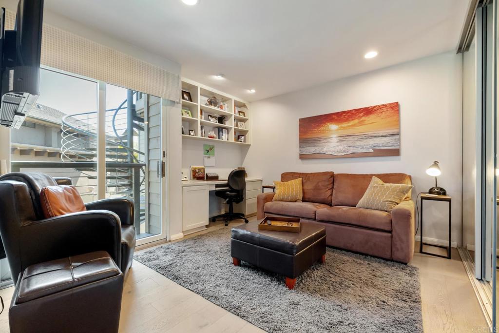 940 Sealane Drive, Unit 14 Encinitas, CA 92024 - Photo 26 of 45 a living room with furniture a rug and a flat screen tv