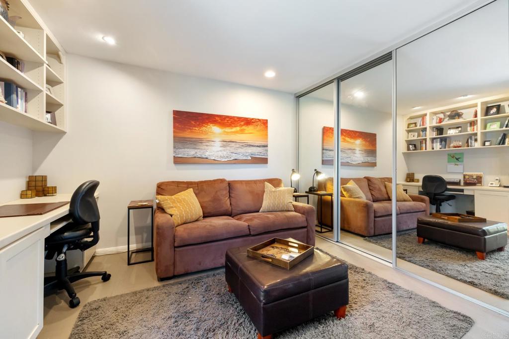 940 Sealane Drive, Unit 14 Encinitas, CA 92024 - Photo 27 of 45 a living room with furniture a rug and a flat screen tv