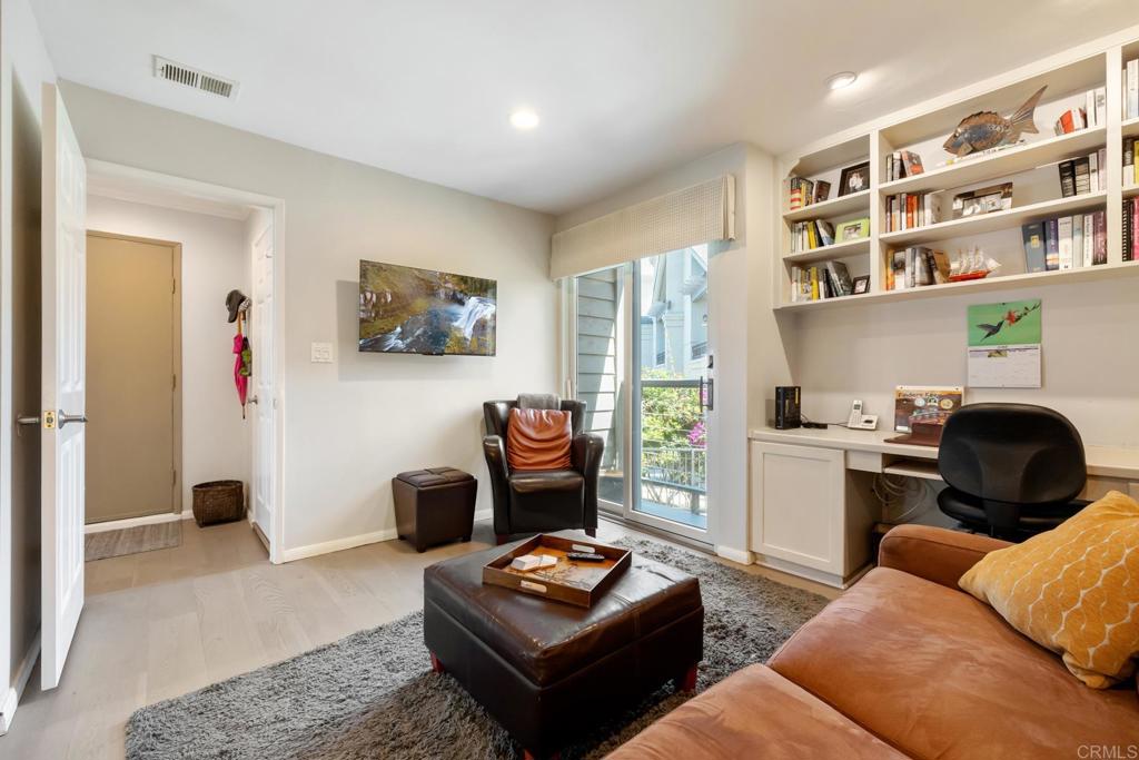 940 Sealane Drive, Unit 14 Encinitas, CA 92024 - Photo 28 of 45 a living room with furniture and a window